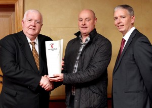 UGAAWA vice-chairman JP Graham hands over the Belleek Living Vase, part of the April Merit Award, to Monaghan manager Malachy O'Rourke with association chairman John Martin (right) keeping a watching brief. Picture by Peadar McMahon.
