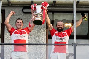 padraig-donaghy-barney-kelly-raise-the-ifc-trophy-high-as-donaghmoyne-are-crowned-2016-champions